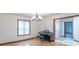 Cozy room featuring a piano, natural light, and views to front entry at 801 Echo Trl, Martinsville, IN 46151