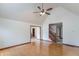 Bright living room featuring high ceilings, hardwood floors, and a ceiling fan at 801 Echo Trl, Martinsville, IN 46151