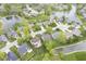 Aerial view of neighborhood with ponds and lush greenery highlighting community charm at 8875 White Fir Dr, Indianapolis, IN 46256
