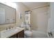 Cozy bathroom featuring a vanity with solid surface countertop and shower-tub combo at 8875 White Fir Dr, Indianapolis, IN 46256