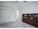 Neutral bedroom with large closet, ceiling fan, and wood display cabinet at 8875 White Fir Dr, Indianapolis, IN 46256