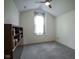 Bright bedroom with neutral carpet, ceiling fan, and large window offering lots of natural light at 8875 White Fir Dr, Indianapolis, IN 46256