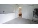 Bright neutral carpeted bedroom with a closet, an open doorway, and an inversion table at 8875 White Fir Dr, Indianapolis, IN 46256