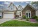 Charming two-story home with a brick facade, and attached two-car garage at 8875 White Fir Dr, Indianapolis, IN 46256