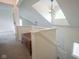 Upstairs hallway featuring natural light, staircase, and a decorative storage bench at 8875 White Fir Dr, Indianapolis, IN 46256