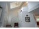 Hallway featuring high ceilings, a staircase, and a view into the living room at 8875 White Fir Dr, Indianapolis, IN 46256