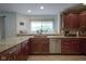 Inviting kitchen with granite countertops, tile backsplash, and stainless steel appliances at 8875 White Fir Dr, Indianapolis, IN 46256