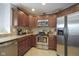 Lovely kitchen featuring granite counters, stainless appliances, and warm wood cabinetry at 8875 White Fir Dr, Indianapolis, IN 46256