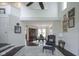 Open concept living room featuring high ceilings, hardwood floors, and an adjacent dining area at 8875 White Fir Dr, Indianapolis, IN 46256