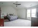 Spacious main bedroom features a ceiling fan and great natural light from large windows at 8875 White Fir Dr, Indianapolis, IN 46256