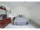 Main bedroom suite features a large bed, ceiling fan, and wood furnishings at 8875 White Fir Dr, Indianapolis, IN 46256