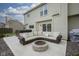 Outdoor patio features a fire pit, a large sectional sofa, and a hot tub at 8875 White Fir Dr, Indianapolis, IN 46256