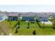 A spacious backyard features a well-maintained lawn, black fencing, and a trampoline at 900 Parker Ln, Westfield, IN 46074