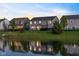 View of backyard, backing to a pond, in a community with green space, and wrought iron fencing at 900 Parker Ln, Westfield, IN 46074