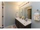 Bathroom featuring a double sink vanity with a dark wood finish at 900 Parker Ln, Westfield, IN 46074