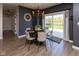 Dining room with round table, chandelier, and sliding glass door with backyard view at 900 Parker Ln, Westfield, IN 46074