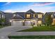 Charming two-story home with a three car garage, manicured lawn, and professional landscaping at 900 Parker Ln, Westfield, IN 46074