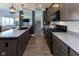Well-equipped kitchen with gray cabinets, modern appliances, and view of the living room at 900 Parker Ln, Westfield, IN 46074