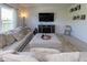 The living room includes comfortable sectional seating, a fireplace, and an entertainment center at 900 Parker Ln, Westfield, IN 46074