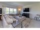 Comfortable living room features a large sectional couch, fireplace, and entertainment center at 900 Parker Ln, Westfield, IN 46074