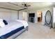 Main bedroom featuring a four-poster bed and a view into the connected bathroom at 900 Parker Ln, Westfield, IN 46074