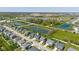 An aerial view of a quiet neighborhood with ponds, green spaces, and neatly arranged homes at 900 Parker Ln, Westfield, IN 46074