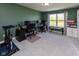 Home office space with two desks, multiple monitors, and a view of a pond at 900 Parker Ln, Westfield, IN 46074