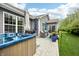 Spacious backyard with a hot tub, outdoor seating, manicured lawn and serene landscaping for outdoor enjoyment at 9359 Foudray N Cir, Avon, IN 46123
