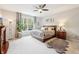 Relaxing bedroom with ceiling fan, cozy furnishings, and bright windows at 9359 Foudray N Cir, Avon, IN 46123