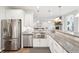 Modern kitchen with stainless steel appliances, granite countertops, and white cabinetry at 9359 Foudray N Cir, Avon, IN 46123