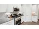 Close-up of a kitchen featuring stainless steel appliances and granite countertops at 9359 Foudray N Cir, Avon, IN 46123