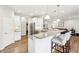 Kitchen with granite countertops, stainless steel appliances, and a breakfast bar with seating at 9359 Foudray N Cir, Avon, IN 46123