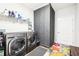 Convenient laundry room featuring modern washer and dryer units at 9359 Foudray N Cir, Avon, IN 46123