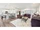 Spacious living room with an open layout, bar seating, and comfortable furnishings at 9359 Foudray N Cir, Avon, IN 46123
