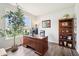 Bright office space with large window, wood desk, and built-in bookshelf at 9359 Foudray N Cir, Avon, IN 46123