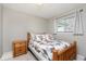 Bedroom with a warm color scheme, natural light, and a ceiling fan at 9748 W Sunset Ln, Elwood, IN 46036