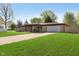 Attractive single-Gathering home with a manicured lawn, inviting entrance, and an attached garage with ample parking at 9748 W Sunset Ln, Elwood, IN 46036