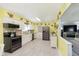 Spacious kitchen featuring stainless steel appliances, wood countertops, and ample storage at 9748 W Sunset Ln, Elwood, IN 46036