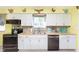 Updated kitchen showcasing wood countertops, stainless-steel appliances, and white cabinetry at 9748 W Sunset Ln, Elwood, IN 46036