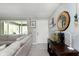 Bright living room showcasing a comfortable sofa, decorative accents, and a view to an outdoor covered patio at 9748 W Sunset Ln, Elwood, IN 46036