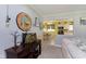 Cozy living room featuring a sofa, stylish decor, and a glimpse into the adjacent updated kitchen at 9748 W Sunset Ln, Elwood, IN 46036