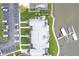 Aerial view of the gray apartments by the water, parking, and boat docks at 102 Clarendon Dr # 506, Noblesville, IN 46062