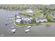 Aerial shot of gray lakeside apartments featuring a nearby community pool, parking and boat docks at 102 Clarendon Dr # 506, Noblesville, IN 46062