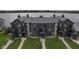 Gray apartment building close to the water featuring stone accents and well-maintained green spaces at 102 Clarendon Dr # 506, Noblesville, IN 46062
