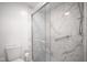 Contemporary bathroom featuring a walk-in shower with marble-style walls at 102 Clarendon Dr # 506, Noblesville, IN 46062
