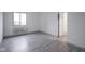 Bright bedroom with wood-look floors, a large window, and modern neutral finishes at 102 Clarendon Dr # 506, Noblesville, IN 46062