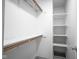Well-organized walk-in closet with custom shelving and stylish marble-patterned countertops at 102 Clarendon Dr # 506, Noblesville, IN 46062