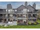 Exterior view of lakeside gray apartments with multiple patios at 102 Clarendon Dr # 506, Noblesville, IN 46062
