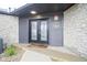 Welcoming front entrance with double doors and stone and wood accents offers charm and security at 102 Clarendon Dr # 506, Noblesville, IN 46062