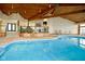 Beautiful indoor pool with lounge chairs and seating areas offering relaxation and recreation at 102 Clarendon Dr # 506, Noblesville, IN 46062